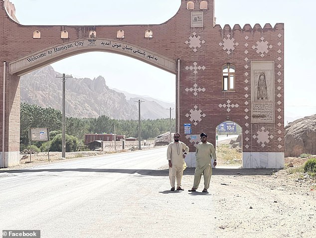 Rahimi is pictured posing in front of the entrance to the city of Bamiyan, a three-hour drive west of the capital, Kabul.