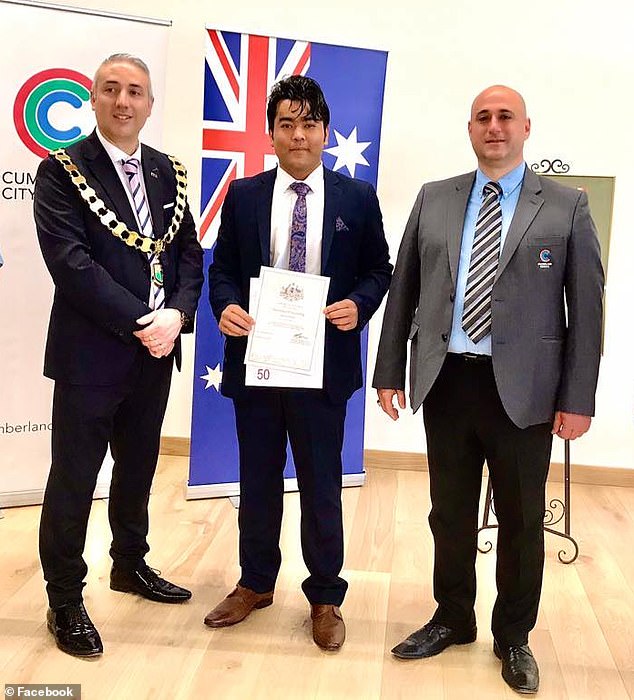 Pictured is Rahimi receiving his Australian citizenship in 2020.