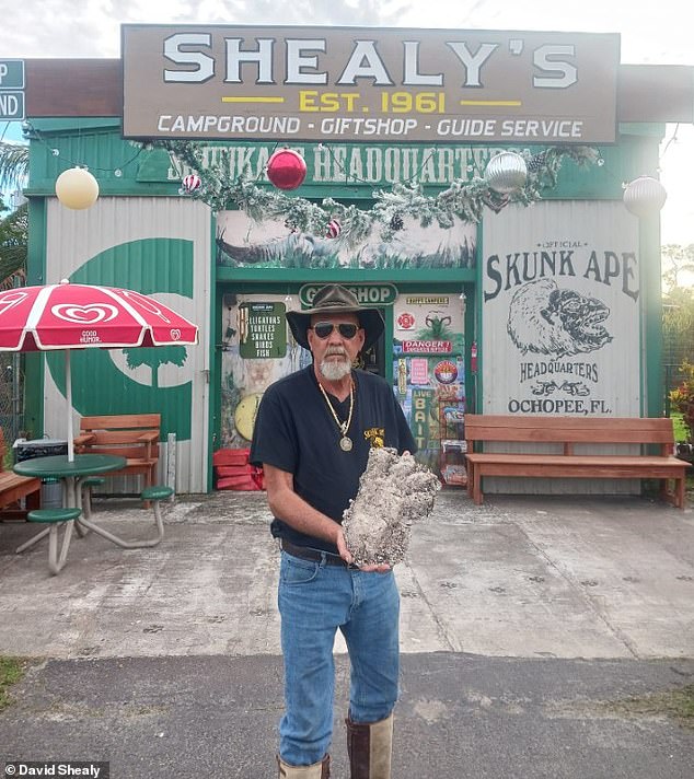 Shealy holds a plaster cast of what he claims is a Skunk Ape footprint