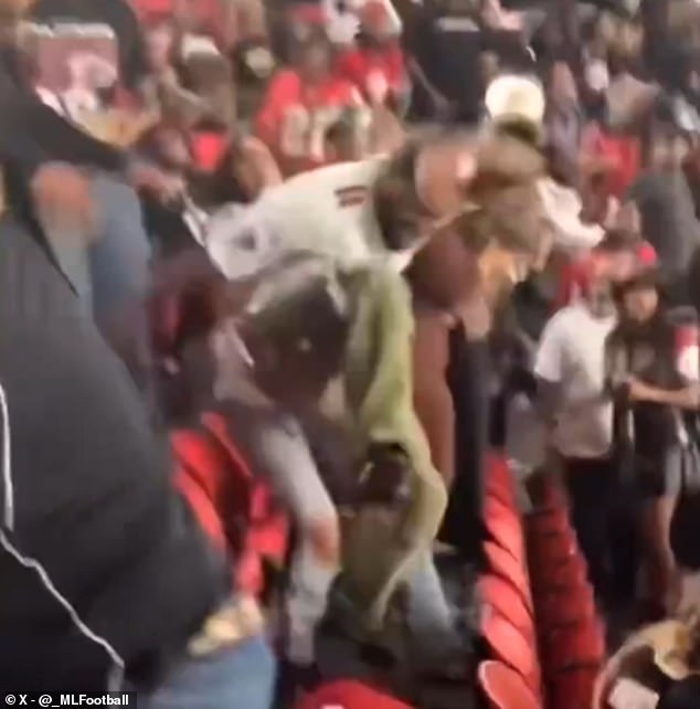 In one clip, a man wearing a Falcons jersey can be seen repeatedly stomping on another man's head.