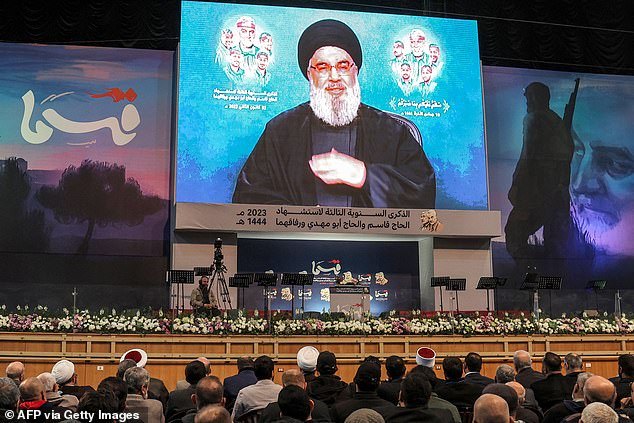 Hezbollah supporters attend a televised speech by the group's leader, Hassan Nasrallah, in the southern suburbs of the Lebanese capital, Beirut, on January 3, 2023.