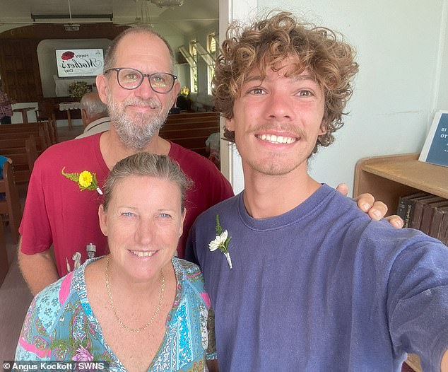 Angus is seen here with his parents. After spending three weeks in Tahiti recovering from his injuries, he flew to South Africa for further treatment.