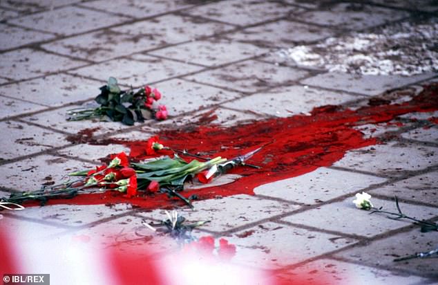 Flowers at the site where Swedish Prime Minister Olof Palme was assassinated in March 1986