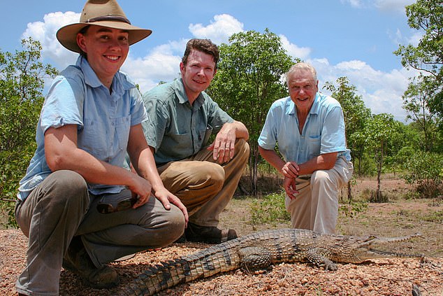 Britton (centre) poses for a photograph with his ex-wife Erin and Sir David Attenborough.