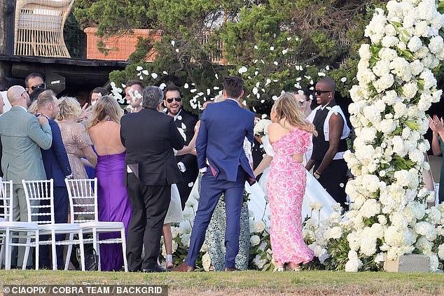 Rebel and Ramona's family and friends, including former TOWIE star Vas J Morgan, and her family showered Rebel with confetti as they walked down the aisle.