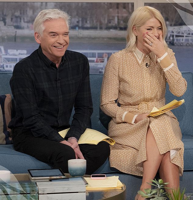 Philip admitted having a secret affair with a younger colleague on ITV's This Morning (pictured on set with Holly Willoughby) but strongly denies harassment allegations.