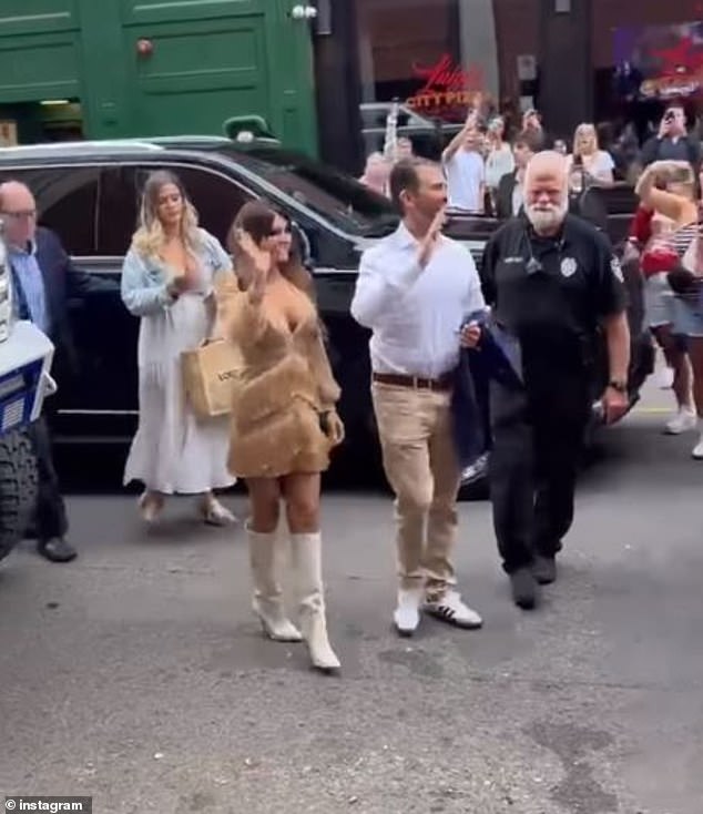 Kimberly, 55, donned a gold dress and white thigh-high boots, while her husband, 46, wore tan dress pants and a white button-down shirt and white sneakers.