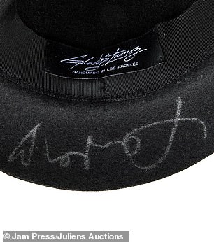 Swift's signature on the hat.