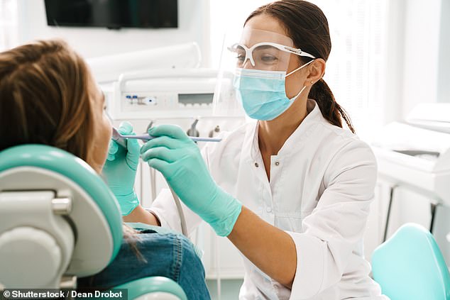 The NHS recommends that under-18s visit the dentist at least once a year because their teeth can decay more quickly than those of adults. (File image)