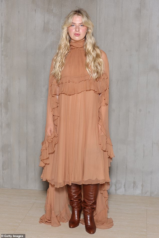 Anais, 24, daughter of Noel Gallagher, looked effortlessly chic in a layered nude dress which she paired with knee-high brown leather boots.