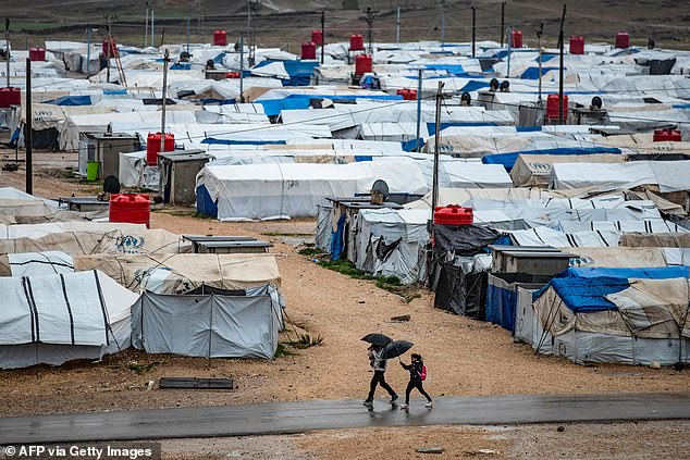 The camp, which is close to the Iraqi border, consists of dozens of tents set up on a dirt and gravel field surrounded by a metal fence.