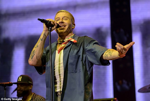 The comedian singled out Macklemore (pictured in May) for leading a 'f*** America' chant at a pro-Palestine festival this week, calling him 'talentless'.