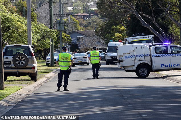 Police are seen outside the Blue Mountains home on Tuesday.