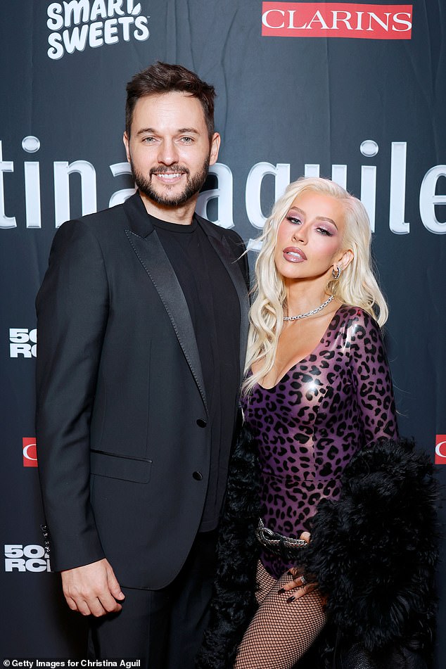 Christina, who wore her platinum hair in soft waves, also posed alongside her fiancé Matthew Rutler at the celebration.