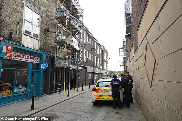 Police community support officers outside the building in Bishop Auckland in County Durham on July 31