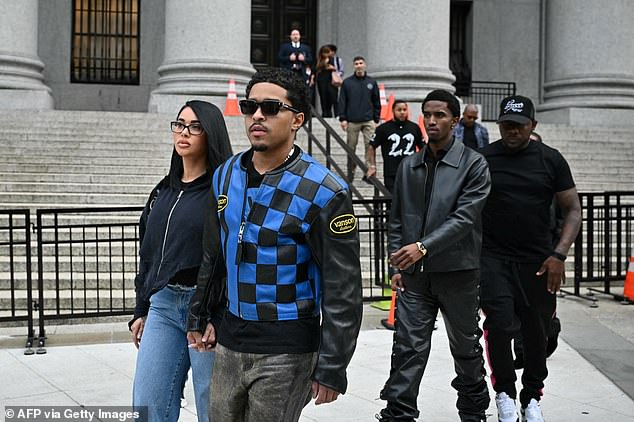 Combs' sons, Justin Combs, 30, and Christian Combs, 26, leave a New York courthouse on September 18.