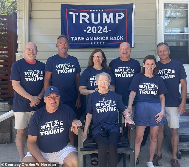 Eight members of Walz's family in Nebraska pose for a picture showing their support for Republican rival Donald Trump