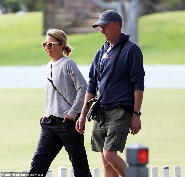 The journalist appeared disheartened as she walked with her husband Tim Baker as they took their dog for a walk in a leafy local park.