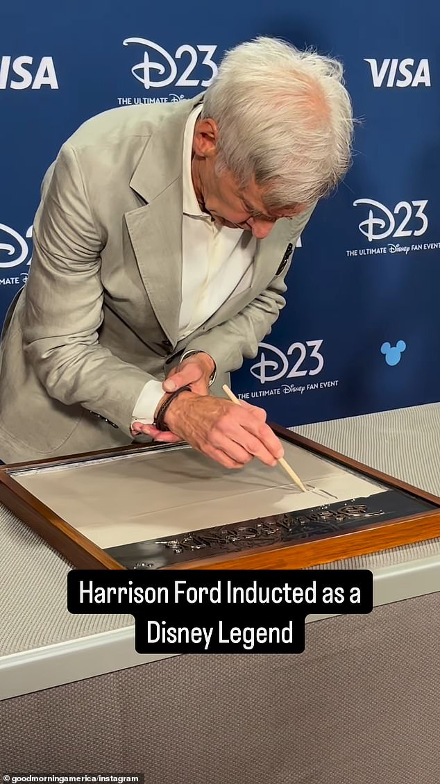 During the ceremony, Ford left his handprints in cement, although fans noted that he had difficulty signing his name next to them.