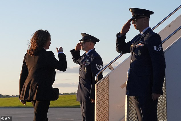 Kamala Harris waves as she boards Air Force 2