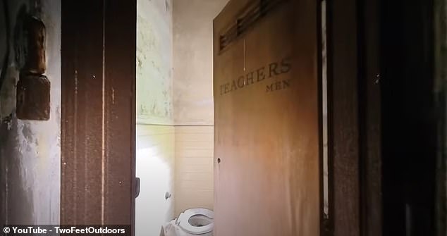 A shot shows the inside of a bathroom with the words 