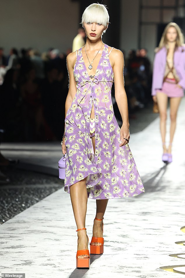 Iris Law also took to the catwalk, showing off her model-like figure in a flowing, sheer purple dress with yellow flowers.