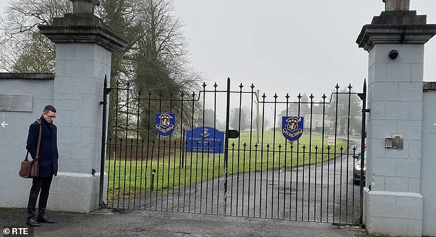 Mr Burke pictured at the gate of Wilson Hospital School in 2023. He has repeatedly defied a High Court injunction banning him from the school premises.