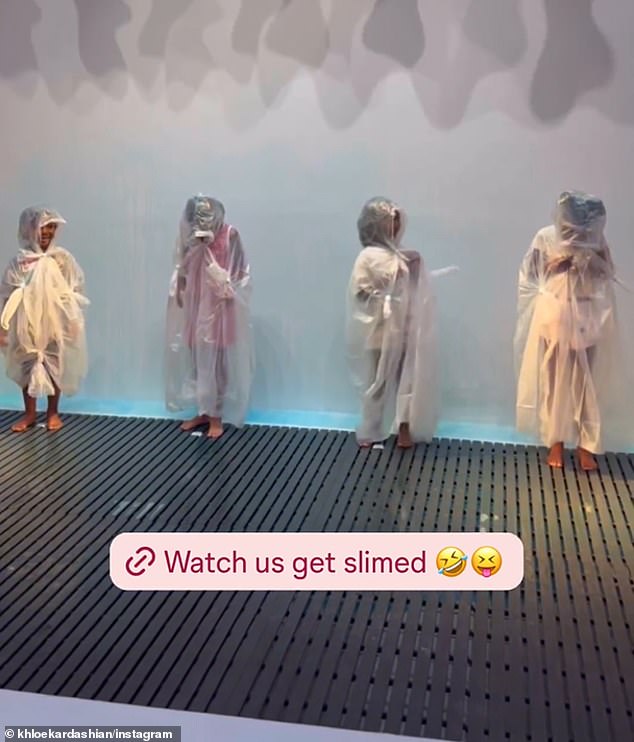 Another post shared via Khloe's Instagram showed True and her friends dressed in sheer ponchos moments before being drenched in slime.