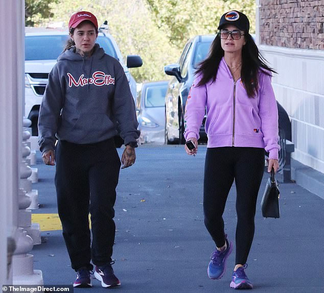 The Real Housewives of Beverly Hills star, 54, wore black leggings with blue and purple sneakers. Wade, 29, looked comfortable in a gray Max Effort sweatshirt with red and white lettering. The Wilder Day singer wore black sweatpants with navy and purple sneakers.