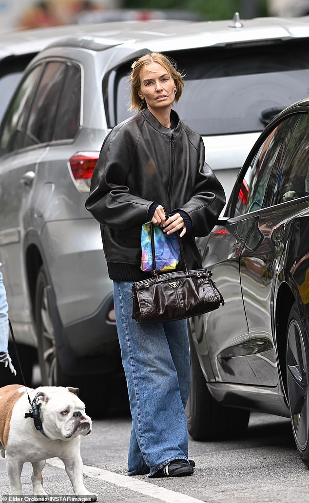 The mother of three stepped out in a pair of very baggy jeans and an oversized leather jacket for the outing.