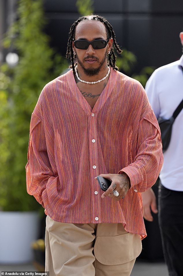 Lewis cut a casual figure in a colourful shirt in his latest quirky fashion statement at the Italian Grand Prix last month.