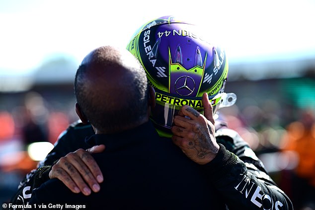 Hamilton celebrated with his father, Anthony, and wiped away tears after their long hug, at the British Grand Prix in July.