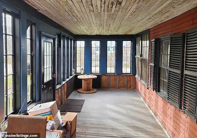 Some areas of the house still remain intact, including a spacious porch with original wood and brick.