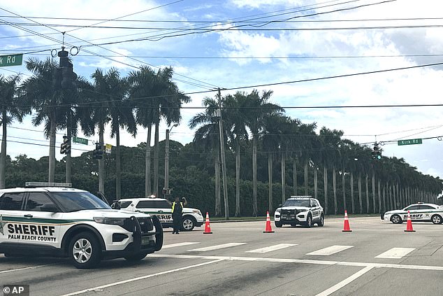 Palm Beach Sheriff's Department vehicles were stationed outside Trump International Golf Club on Sunday after gunshots were reported in the vicinity of where the former president was playing golf.