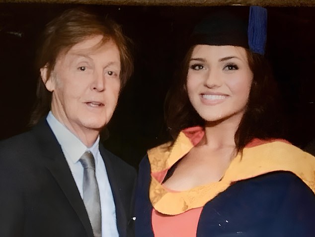 Emily beams in a photo with Paul McCartney, taken at her 2017 graduation from the Liverpool Institute of Performing Arts.