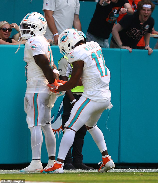 After scoring a touchdown, he celebrated by imitating the moment he was handcuffed and arrested by police.