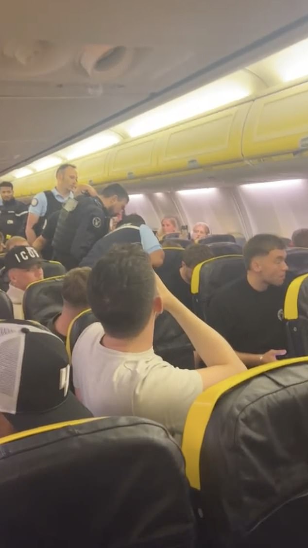 A flight was diverted after a drunken Briton drank vodka, punched the crew and spat on passengers.