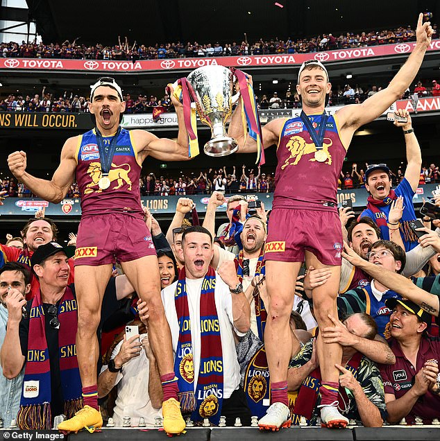 The Swans had no answers to Brisbane's attacking brilliance (pictured left, Charlie Cameron and Josh Dunkley with the Premiership Cup)