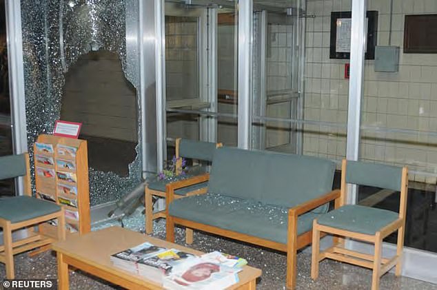 Pieces of shattered tempered glass litter chairs and seats at Sandy Hook Elementary School after the December 2012 shooting