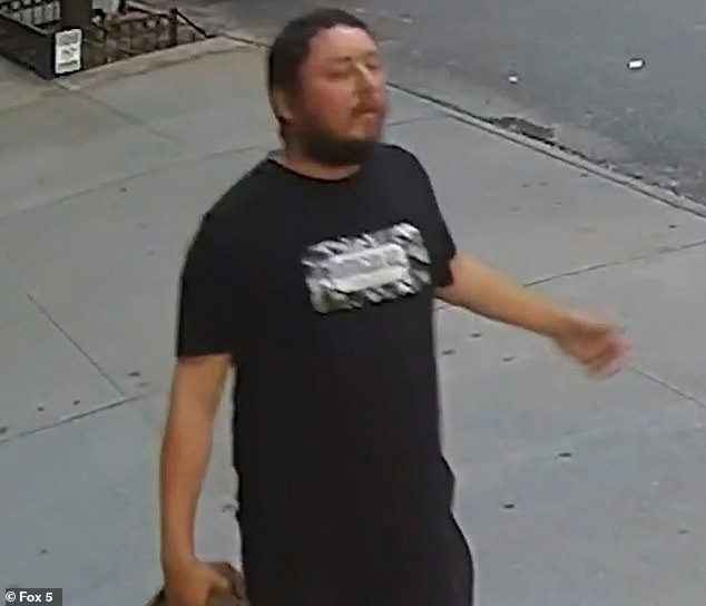 The suspect (pictured), who was wearing black pants and a shirt, initially walked past Gloria.