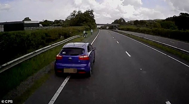 Further down the road, a stopped car can be seen which Catterall does not notice. His truck crashes into the side of the car and nearly runs over people standing on the side of the road.