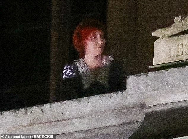 Lady Gaga, 38, was spotted wearing a short red wig on a balcony of the famous French museum on Friday night and Saturday morning.