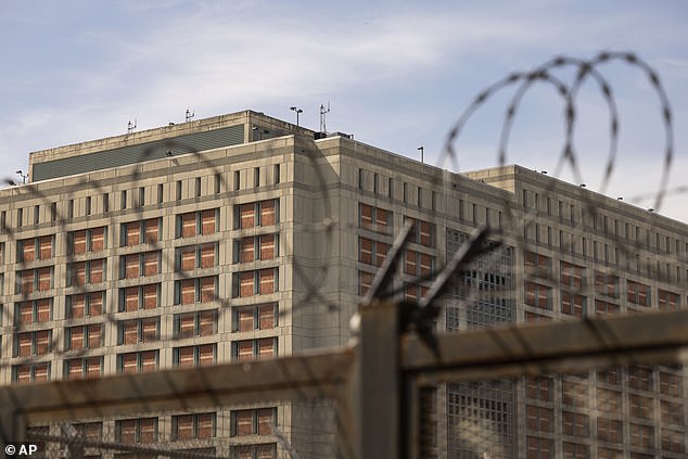 The Metropolitan Detention Center is seen through barbed wire in the Sunset Park neighborhood of the Brooklyn borough of New York City.