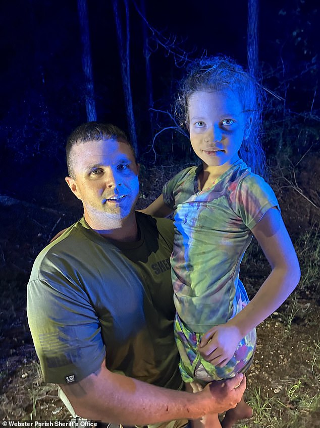 Police woke 10-year-old Peyton Saintignan (pictured) from her sleep on the forest floor and carried her to safety.