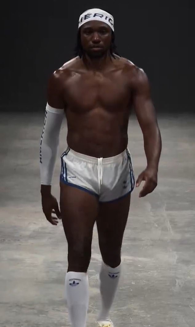 The Olympic 100-meter king strutted down the catwalk in shorts, socks and Adidas sneakers