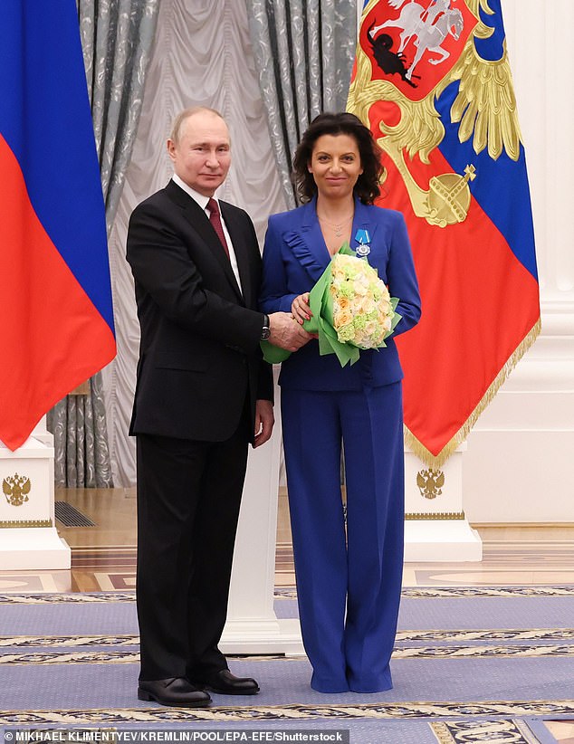 Russian President Vladimir Putin is pictured with RT editor-in-chief Margarita Simonyan in December 2022. Simonyan is one of 10 individuals and two entities sanctioned by the Treasury Department.