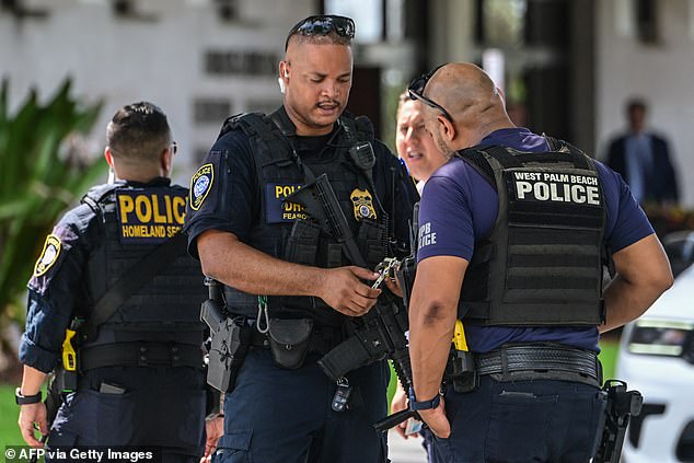 Department of Homeland Security police officers stand guard outside the Paul G. Rogers Federal Building as Routh pleads guilty.