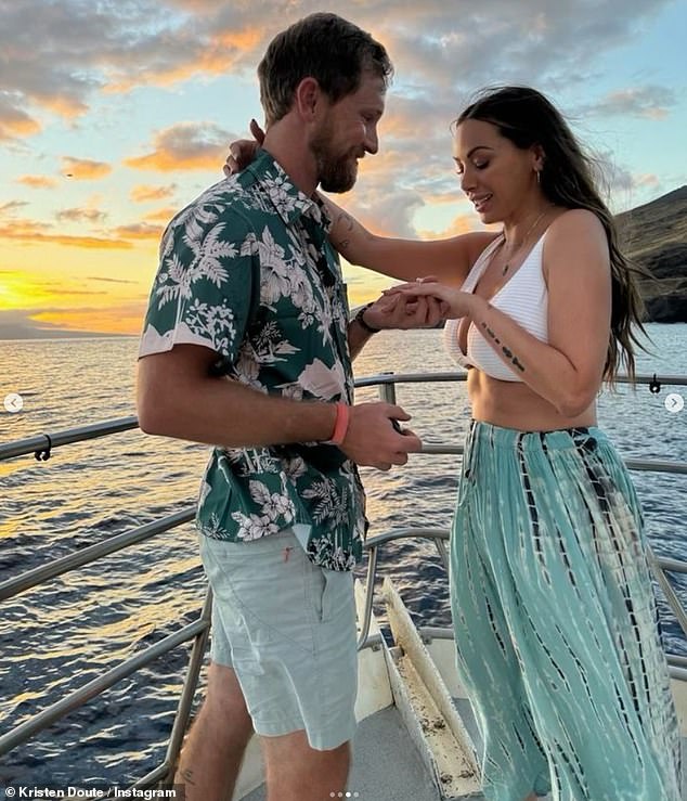 The photos showed Doute, showing off her abs in a white crop top and skirt, and looking visibly excited as she looked at her ring.