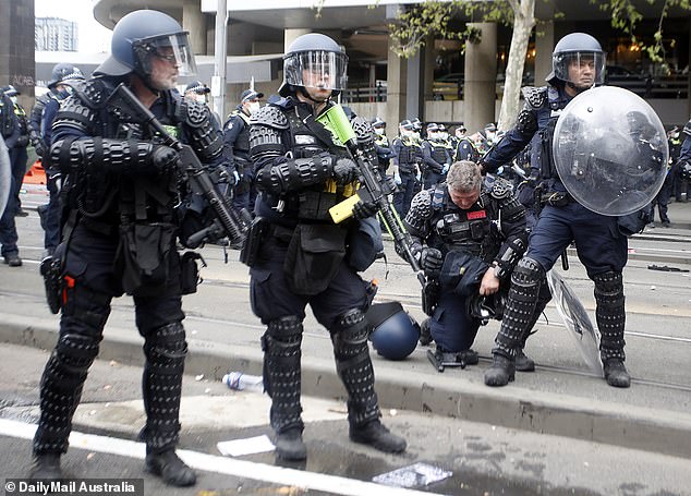 Officer falls amid chaos at Melbourne protests