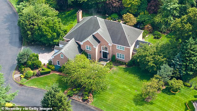 The couple's five-bedroom, $4 mansion in Manhasset, New York, was raided by the FBI on Tuesday morning.